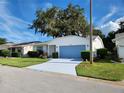 Well-maintained single-story home boasts green lawn and a driveway leading to an attached one car garage at 651 Timbercrest Dr, Leesburg, FL 34748