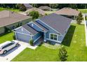 Inviting single-Gathering residence with manicured lawn, a two-car garage, and attractive curb appeal at 7732 Sloewood Dr, Leesburg, FL 34748