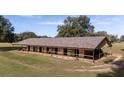 Spacious horse barn with multiple stalls, offering ample shelter and storage on sprawling land at 1801 Ne 77Th St, Ocala, FL 34479