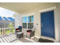 Inviting covered front porch with seating area, a perfect spot to enjoy a morning coffee at 9200 Se 48Th Court Rd, Ocala, FL 34480