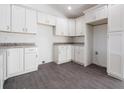 Kitchen featuring granite countertops, and bright white cabinets at 700 Fisher Rd, Ocklawaha, FL 32179