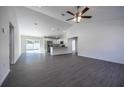 Open-concept living room flows into kitchen with stainless steel appliances at 600 Ne 130Th Ter, Silver Springs, FL 34488