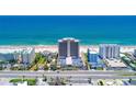 Stunning aerial view of a beachfront condominium complex with ocean views and easy beach access at 89 S Atlantic Ave # 204, Ormond Beach, FL 32176