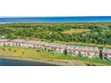 Condo exterior with lush green lawn and views of the river behind the property, perfect for outdoor relaxation at 14 Ocean Palm Villa S # 14, Flagler Beach, FL 32136