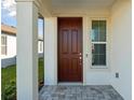 Exterior front door with sidelight window at 6043 Sw 93Rd Cir, Ocala, FL 34481