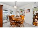 Cozy dining area with a wooden table and chairs, adjacent to the kitchen at 5315 Nw 25Th Loop, Ocala, FL 34482