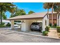 Condo carport with parking space for one vehicle at 1 Tomoka Oaks Blvd # 102, Ormond Beach, FL 32174