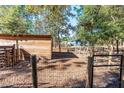 Wooden shed and fenced backyard with mature trees at 5919 Sw 124Th Terrace Rd, Ocala, FL 34481