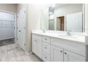 Double vanity bathroom with white cabinets and quartz countertops at 5919 Sw 124Th Terrace Rd, Ocala, FL 34481