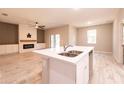 Modern kitchen island with white cabinets and quartz countertops at 5919 Sw 124Th Terrace Rd, Ocala, FL 34481