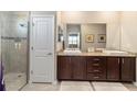 Double vanity bathroom with granite countertop and large shower at 8731 Sw 76Th Street Rd, Ocala, FL 34481