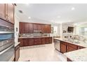 Modern kitchen with stainless steel appliances and granite counters at 8731 Sw 76Th Street Rd, Ocala, FL 34481