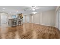 Hardwood floor living room with a view of the kitchen at 8036 Sw 78Th Terrace Rd, Ocala, FL 34476