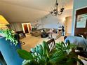 Living room with L-shaped couch and large window at 1328 Spring Lite Way, Orlando, FL 32825