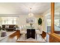 Bright dining area with glass table and modern chandelier at 3261 Se 32Nd St, Ocala, FL 34471