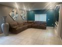 Spacious living room featuring a sectional sofa and modern fireplace at 45 Orchid Ct, Kissimmee, FL 34759