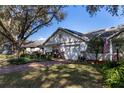 Charming single-Gathering home with well-maintained landscaping, solar panels, and an inviting front porch area at 9691 Sw 95Th Ct # A, Ocala, FL 34481