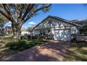 Lovely single-story home featuring a manicured lawn and a spacious driveway leading to a single-car garage at 9691 Sw 95Th Ct # A, Ocala, FL 34481