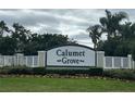 The Calumet Grove community sign surrounded by manicured landscaping gives an inviting welcome at 16862 Se 80 Bellavista Cir, The Villages, FL 32162