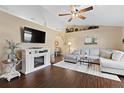 Bright living room with a vaulted ceiling, cozy fireplace, and stylish decor at 1762 Ne 39Th St, Ocala, FL 34479
