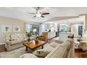 Inviting living room with comfortable seating, views of the kitchen, and access to the outdoor patio at 906 Crestview Dr, Auburndale, FL 33823