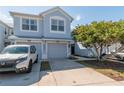 Charming two-story townhouse with a well-manicured lawn and driveway, providing an inviting curb appeal at 4410 Sw 52Nd Cir # 108, Ocala, FL 34474