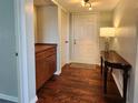 Inviting entryway features wood floors, storage cabinets, and a stylish console table with lamp at 3370 Ocean Shore Blvd # 5020, Ormond Beach, FL 32176