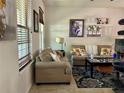 Cozy living room with neutral color scheme, comfortable seating, and patterned rug creating a relaxed and inviting space at 5108 Caspian St, St Cloud, FL 34771