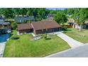 A delightful single-Gathering house displaying mature landscaping and a concrete driveway leading to an attached garage at 2030 Se 32Nd Ln, Ocala, FL 34471