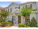 Townhome with well-kept landscaping and light blue siding at 2950 Lucayan Harbour Cir # 107, Kissimmee, FL 34746