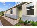 Attractive exterior with large window and brick-paved walkway at 5237 Nw 48Th Pl, Ocala, FL 34482