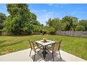 Outdoor patio with a table and chairs offers a cozy spot for relaxation at 680 Nw 67Th Pl, Ocala, FL 34475