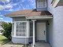 Charming front entry featuring a white door, trimmed windows, and column at 2233 Ardon Ave, Orlando, FL 32833