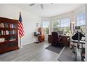 Office space with lots of natural light, wood floors, and an exercise machine at 9478 Sw 52Nd Loop, Ocala, FL 34481