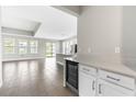 An open-concept kitchen with modern appliances, an island and plenty of natural light at 3940 Se 5Th Ave, Ocala, FL 34480