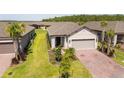 Attractive single-Gathering home with a brick driveway, well-manicured lawn, and beautiful landscaping at 1192 Via Galuppi St, Kissimmee, FL 34759