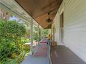 Relaxing side porch with ample space, great for enjoying the outdoors at 5881 Avenue H, Mc Intosh, FL 32664