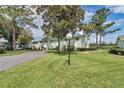 Scenic view of condos surrounded by lush greenery and mature trees at 487 Midway Dr # B, Ocala, FL 34472
