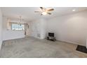 Bright and airy living room featuring neutral carpet and an open layout, perfect for entertaining at 4426 Sw 49Th Ave, Ocala, FL 34474