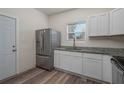 Modern kitchen with stainless steel appliances and granite countertops at 412 2Nd Sw St, Winter Haven, FL 33880