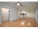 Open living space showcases tile flooring connecting the living room to the kitchen at 5011 Hemingway Cir # 5011, Haines City, FL 33844
