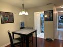 Modern dining area next to a kitchen at 200 El Camino Dr # 102, Winter Haven, FL 33884