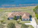 Stunning aerial view of a home with a spacious lot and a serene lake backdrop at 2656 S Scenic Hwy, Lake Wales, FL 33898