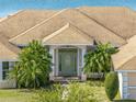 Close up of a home's front door with well-maintained landscaping at 2656 S Scenic Hwy, Lake Wales, FL 33898