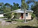 Inviting home featuring a charming exterior with beautiful landscaping, creating a welcoming atmosphere at 332 Jackson St, Lake Wales, FL 33859