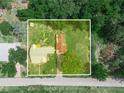 Aerial view of the property, highlighting its expansive lot and surrounding greenery at 111 D St, Frostproof, FL 33843