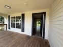 View of the front porch with a doorway leading into the house at 111 D St, Frostproof, FL 33843