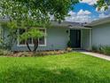 Well maintained front yard with lush green grass and professional landscaping, leading to a welcoming front entrance at 1144 Cephia St, Lake Wales, FL 33853