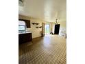 Open-concept kitchen/dining area provides a spacious flow and access to the backyard at 405 S Shore Dr, Eagle Lake, FL 33839