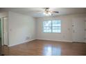 Inviting living room with wood floors, a large window and closet space at 4725 Kayworth Rd, Lake Wales, FL 33898
